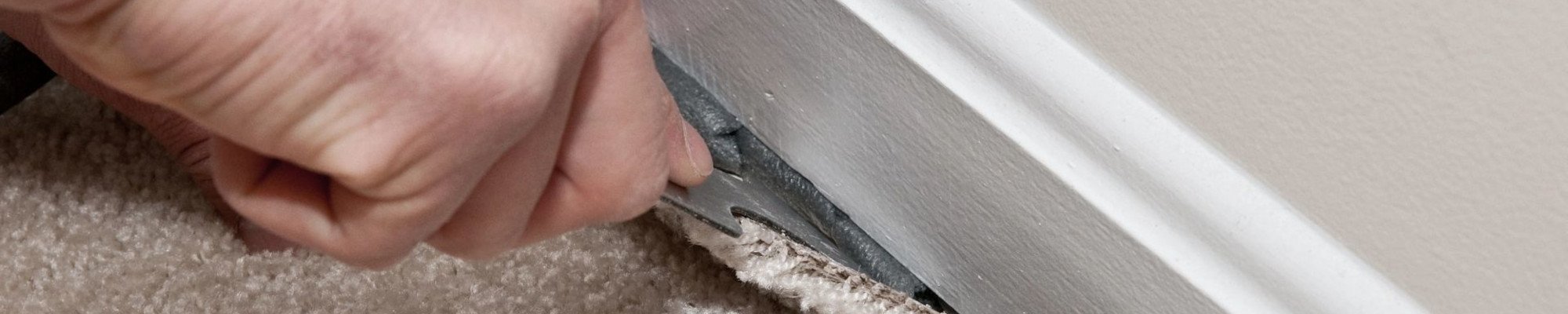 person installing carpet