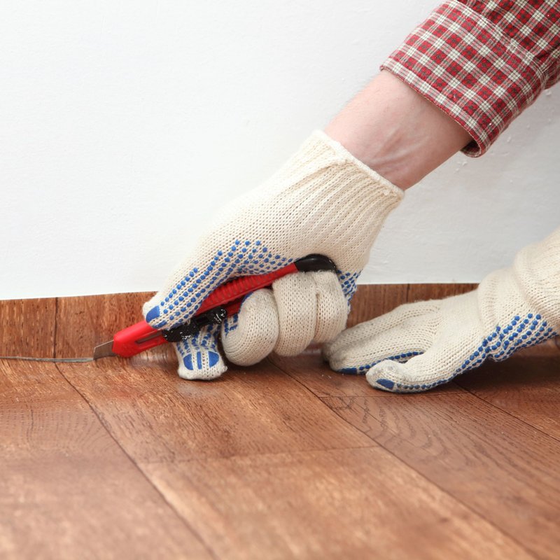 person installing vinyl floor